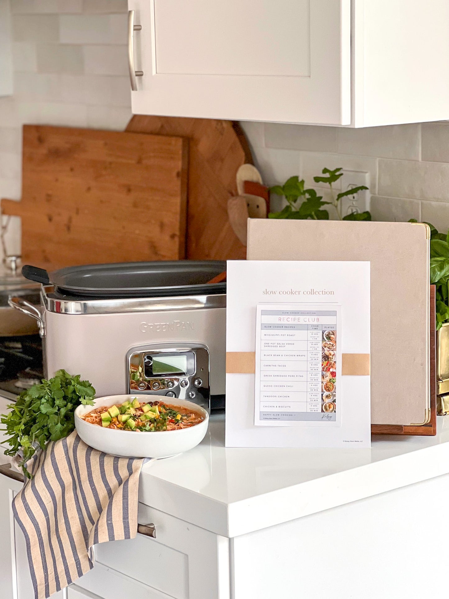 Slow cooker collection of printed recipes with Recipe Binder and crockpot